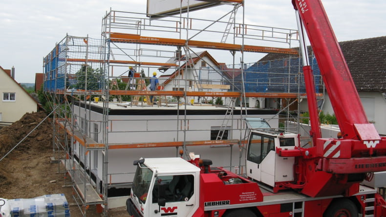 Imagen de una casa en construcción financiada