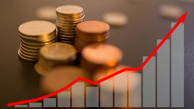 Imagen de dinero haciendo referencia a la inflación y deflación en el sector inmobiliario